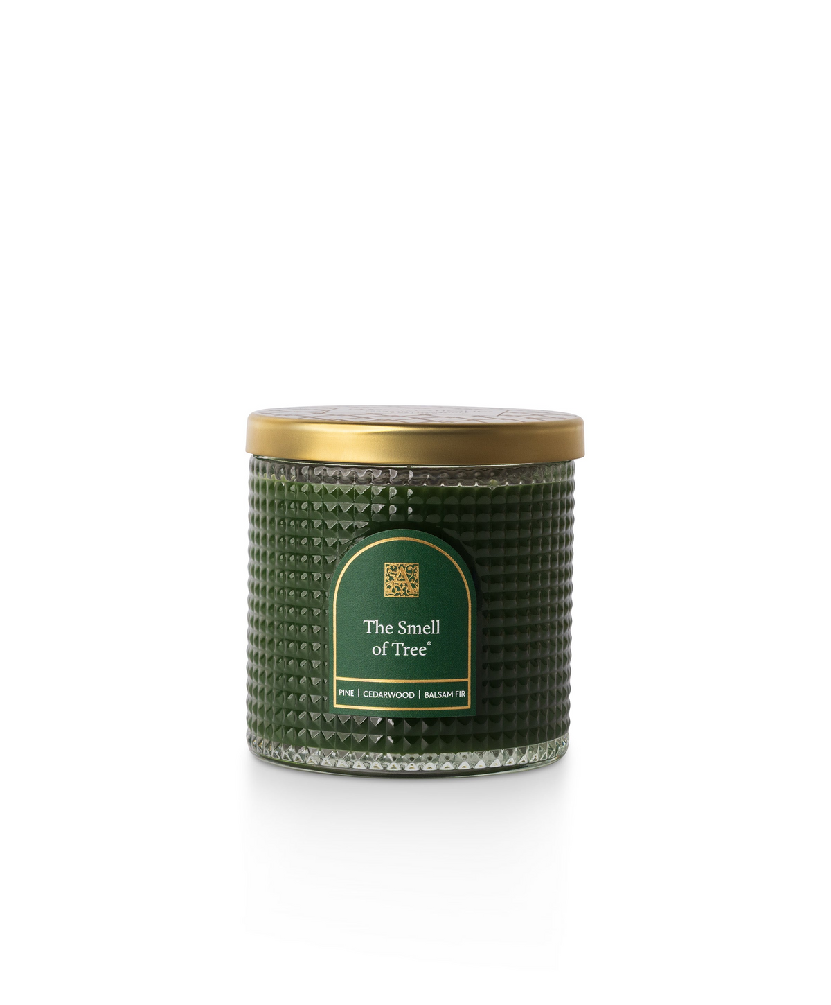 The Smell of Tree textured green glass candle with a gold metal lid and pine fragrance notes.