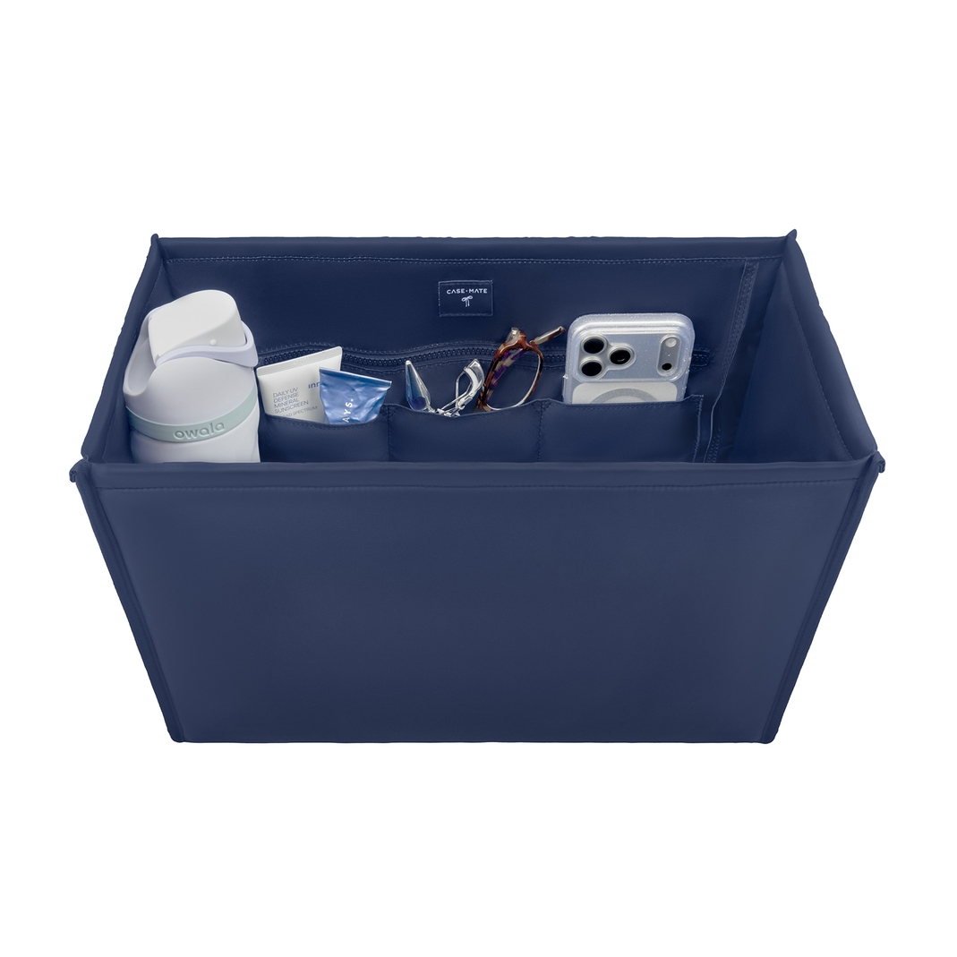 Navy blue medium tote organizer insert with a water bottle, phone, and accessories in compartments.