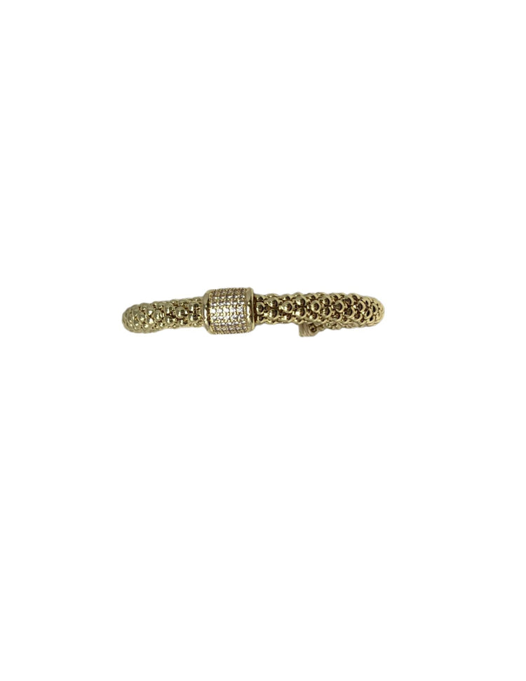 Gold mesh weave cuff bracelet with a central pavé diamond-encrusted band.