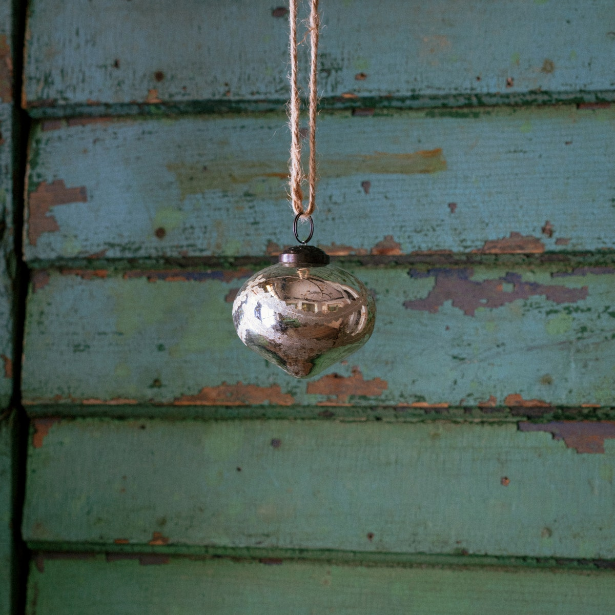 Venetian Glass 3" Onion Ornament with a silver mercury finish hanging from a twine string.