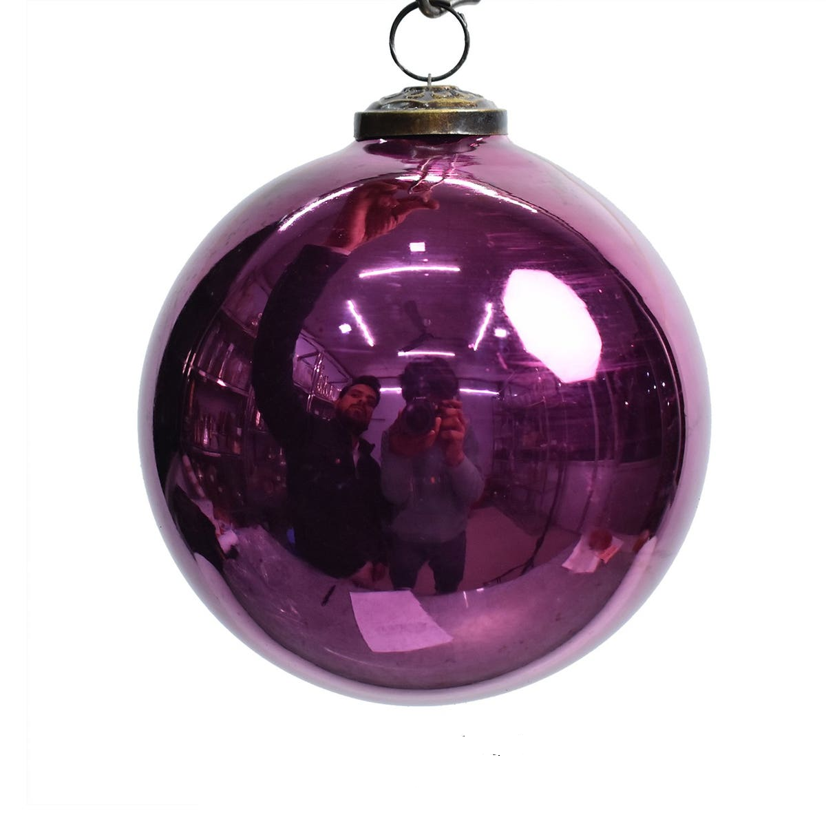 5-inch vintage cranberry glass ball ornament with a metallic finish and antique brass cap.