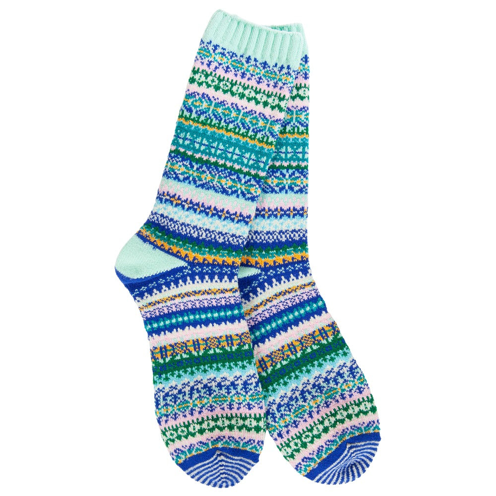 Pair of mint green crew socks with a colorful Nordic Fair Isle pattern in blue, pink, and green.