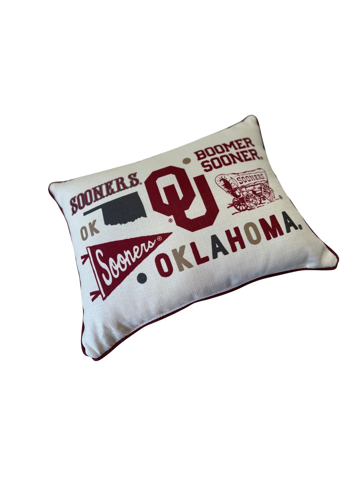 Oklahoma Collegiate cluster pillow with piping trim on a coordinated back panel.
