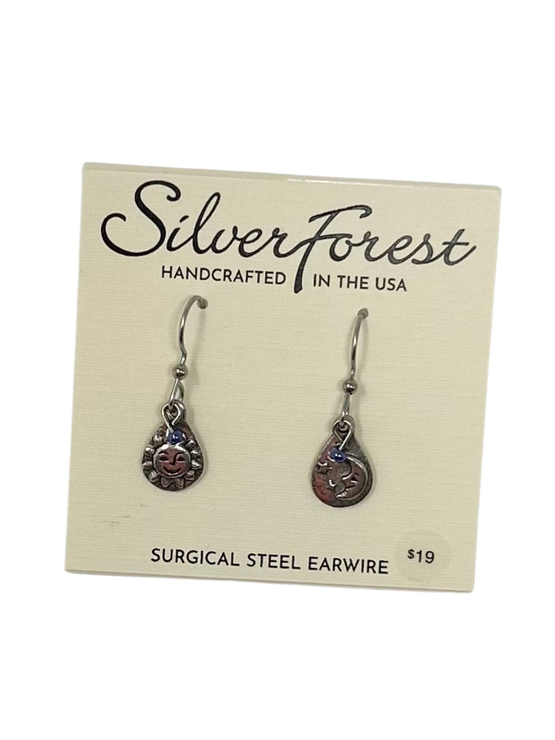 Hand-soldered surgical steel earrings featuring a playful sun and moon celestial duo design with fish hook backs.