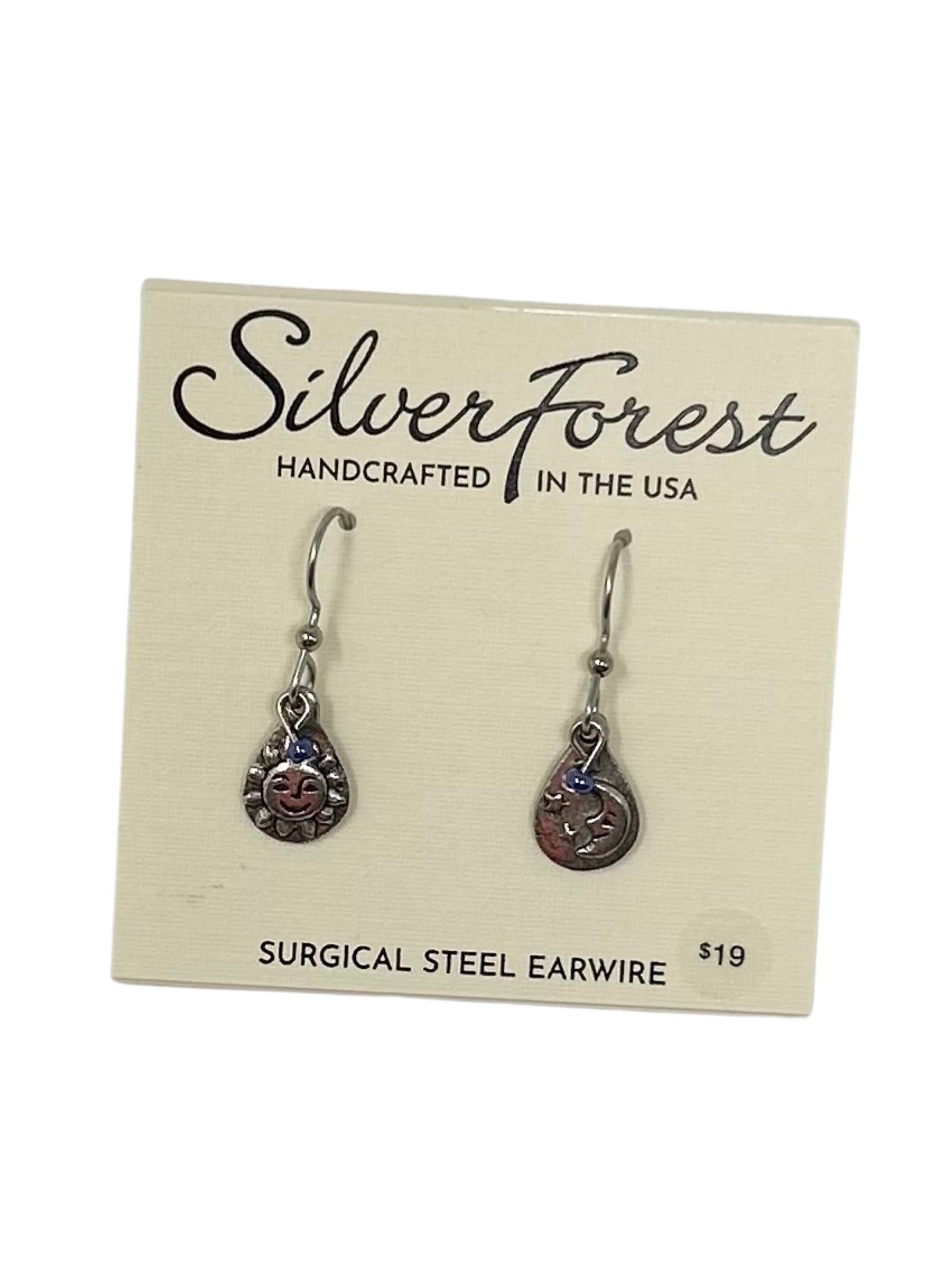 Hand-soldered surgical steel earrings featuring a playful sun and moon celestial duo design with fish hook backs.