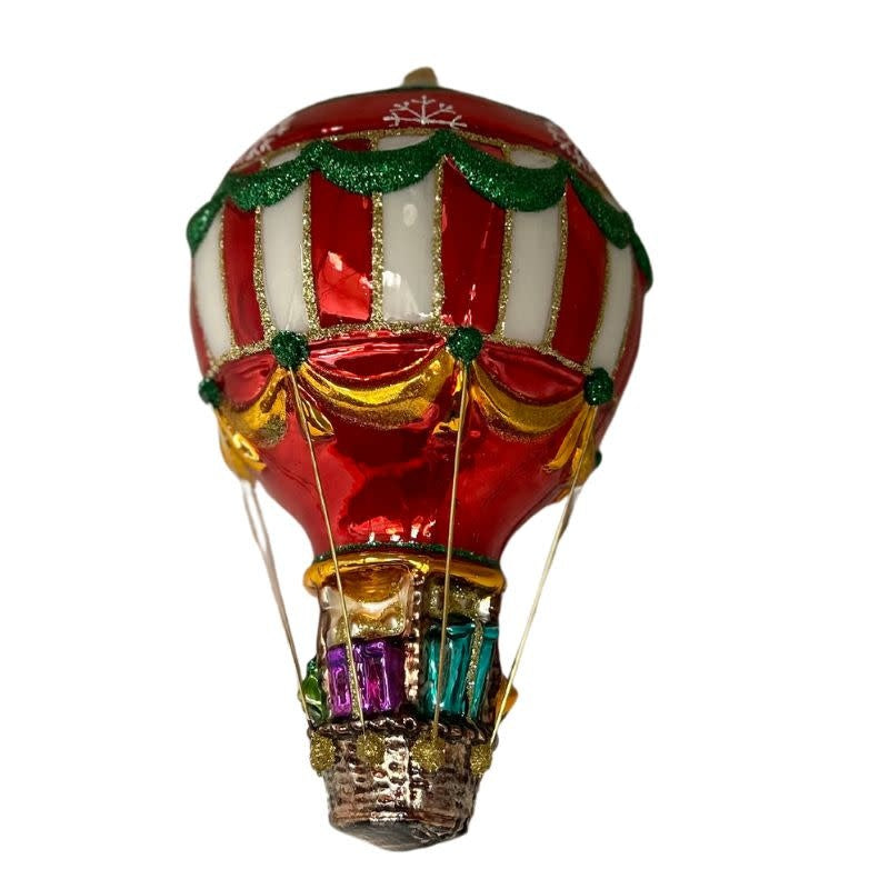 Hand-blown glass hot air balloon ornament with red and white stripes and a gift-filled basket.