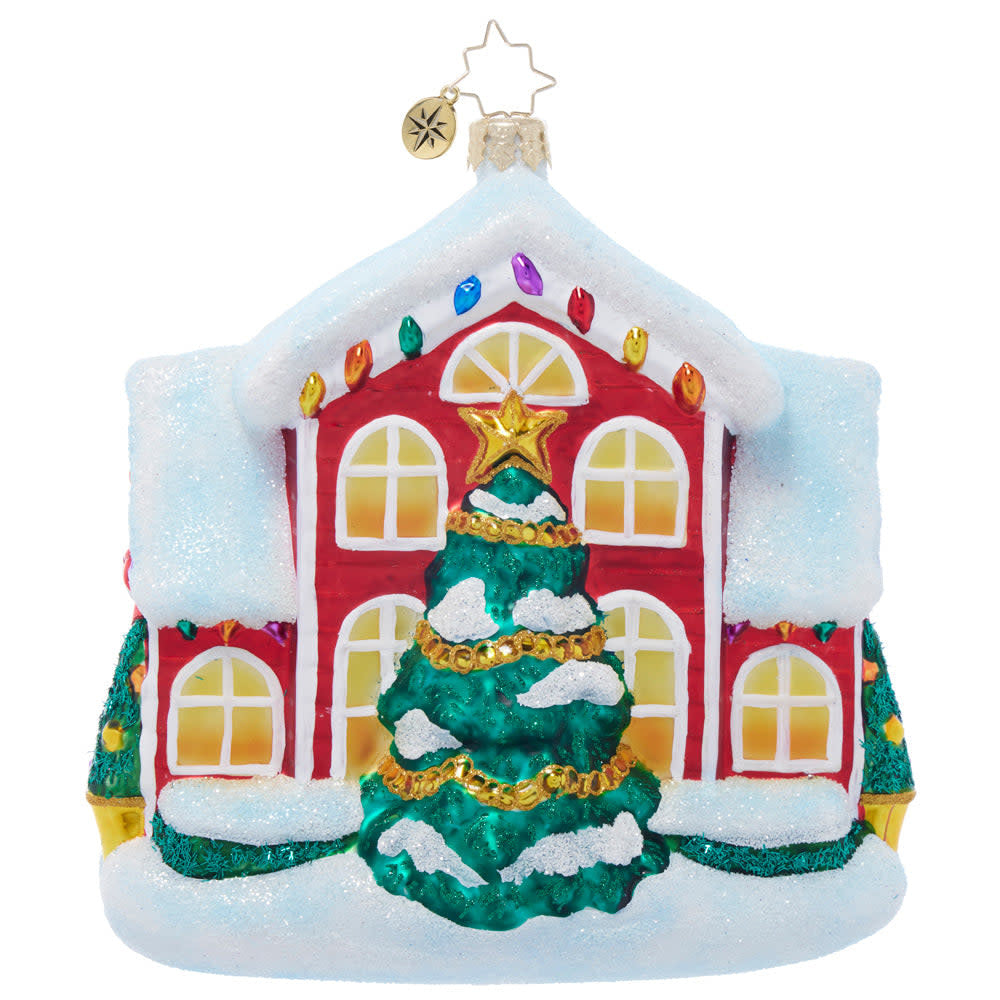 A New Holiday Home decorative house figurine in white snow with festive lights.