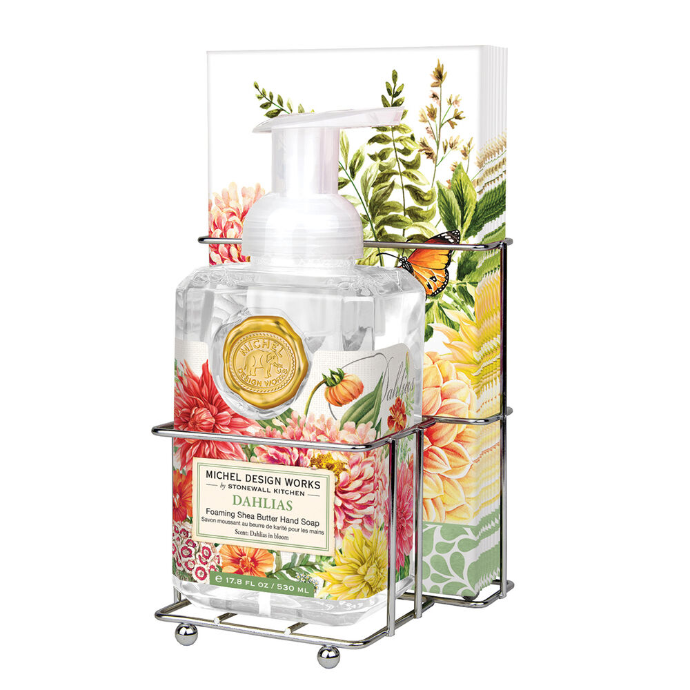 Compact foaming hand soap dispenser with matching napkin holder in neutral tones.