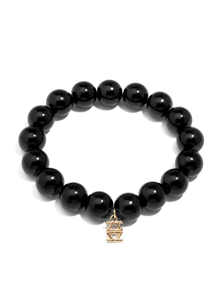Stretch bracelet with glossy lucite glass beads in a solid color.