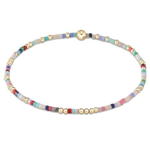 Hope Unwritten bracelet featuring mixed seed beads in various colors with gold-filled accents on elastic cord.
