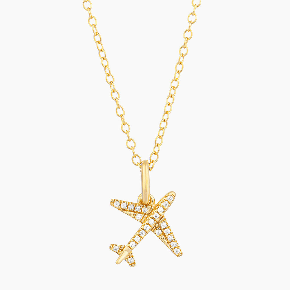 Sterling silver pendant necklace with gold-plated finish featuring a small diamond accent on an adjustable chain.