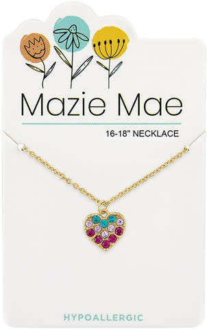 Gold Mazie Mae necklace with a heart pendant featuring multi-colored crystals on a display card.