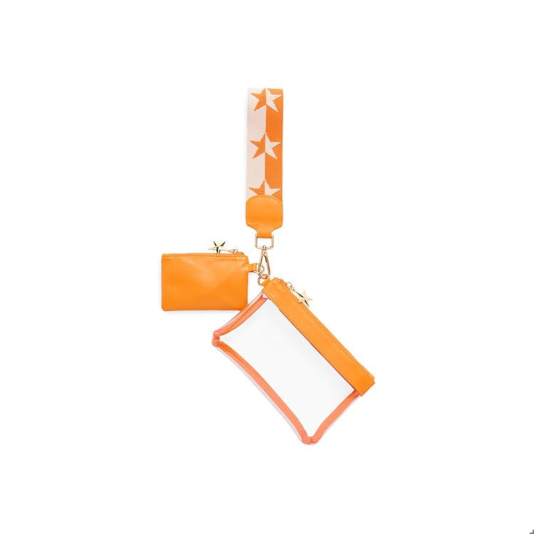 Orange Spectator Wristlet with a clear pouch, small solid pouch, and star-patterned strap.