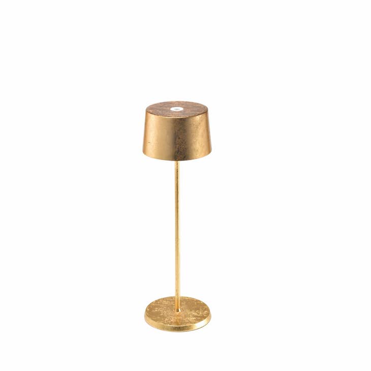 Die-cast painted aluminum Olivia Pro table lamp with translucent top in neutral tone.