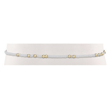 Gameday Hope Unwritten bracelet featuring a vibrant seed bead pattern with gold-filled accents on stretch elastic.
