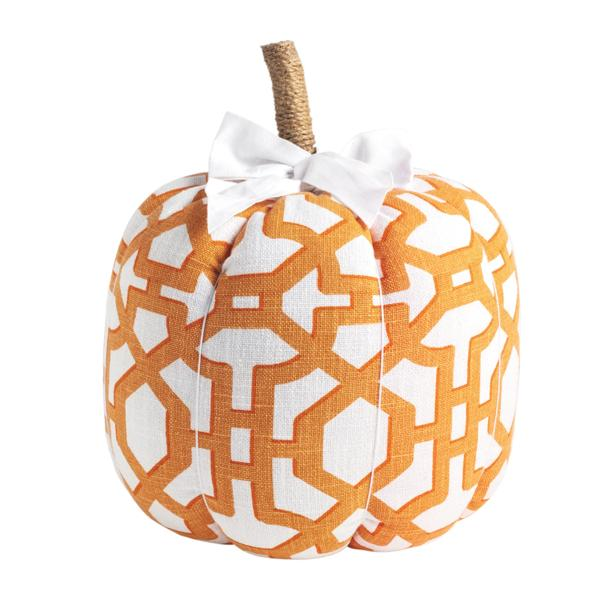 Orange and white geometric patterned fabric pumpkin with a jute stem and white grosgrain bow.
