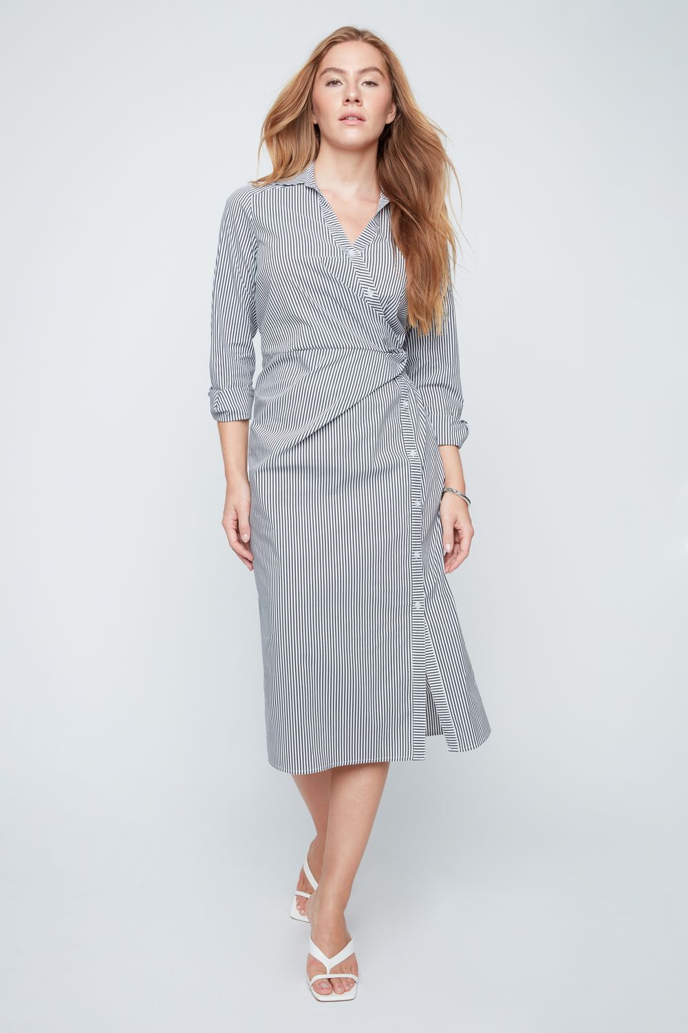 Sharon Woven Dress in beige with a faux-wrap front, V-neckline, traditional collar, and A-line silhouette.
