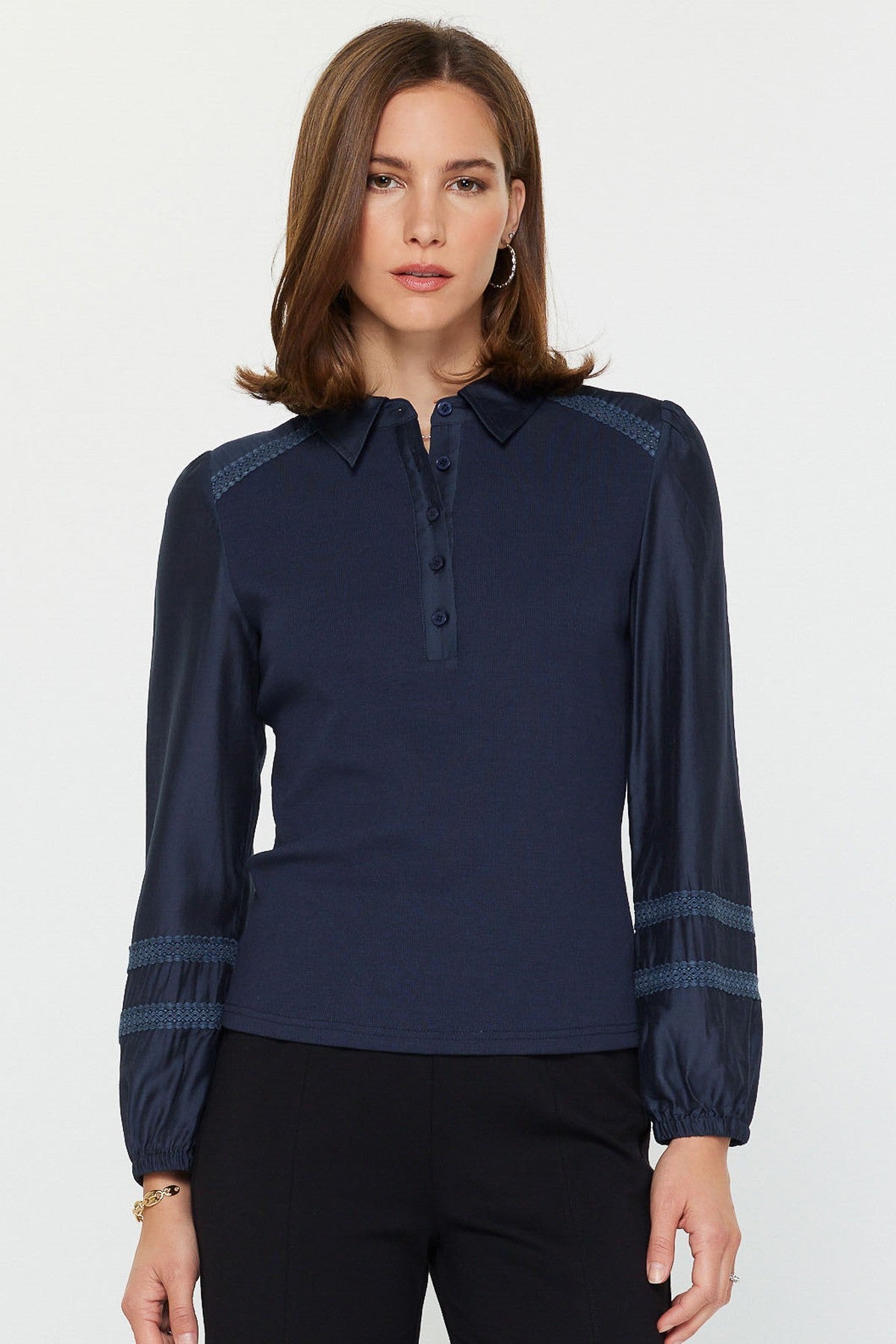 Abigail mixed media polo knit top in light blue with woven sleeves, lace shoulder trim, and half-button placket.