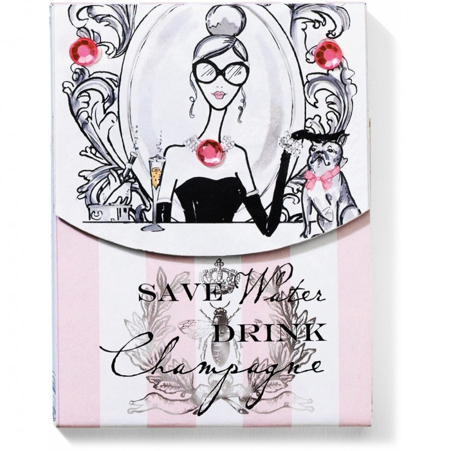 Multi-colored pocket notepad with magnetic closure featuring a champagne glass illustration on the cover.