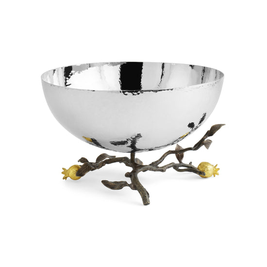Hammered stainless steel serving bowl on an oxidized brass branch base with gold pomegranate accents