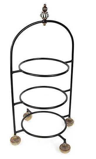Large iron plate stand with brass accents featuring a wide rectangular base.