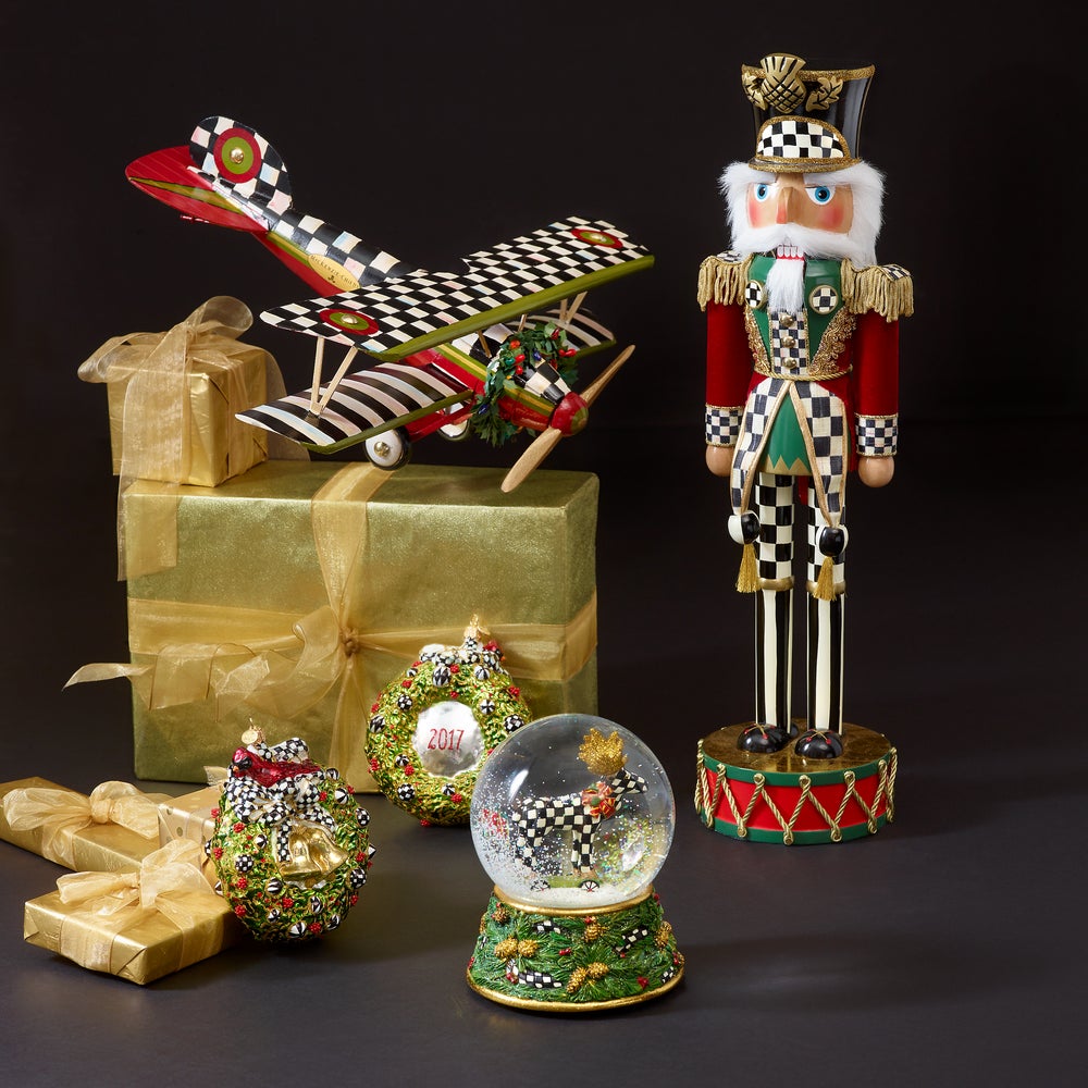 Highland Nutcracker in red and green holiday attire with signature Courtly Check patterns.