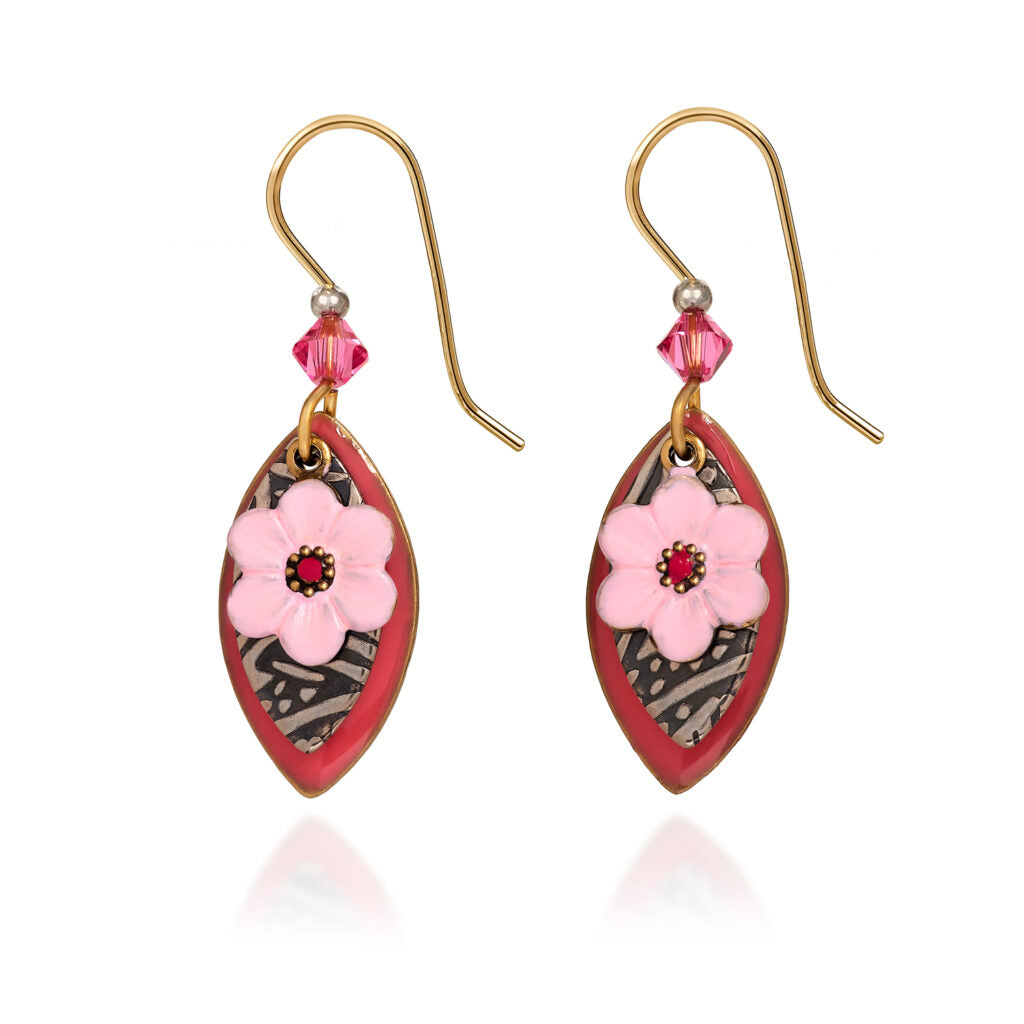 Layered football-shaped earrings with pink flowers, red enamel, and crystal accents on gold hooks.