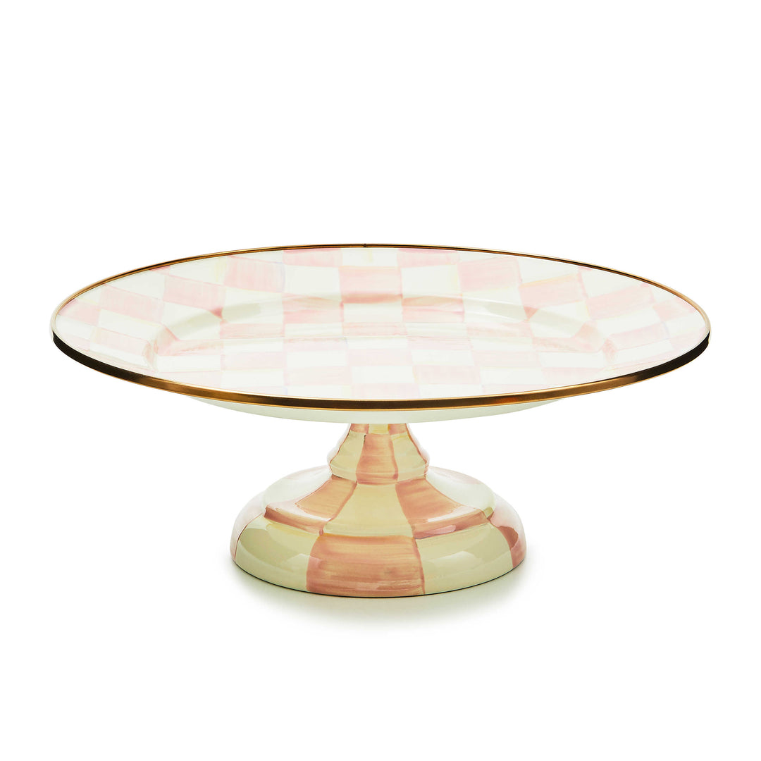 Small pedestal platter with hand-painted pink and white checks and a bronzed stainless steel rim.