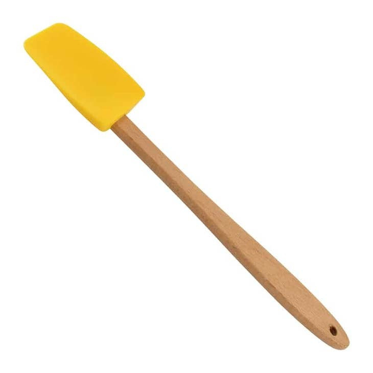 Mini silicone spatula with a compact handle designed to slide under delicate foods.