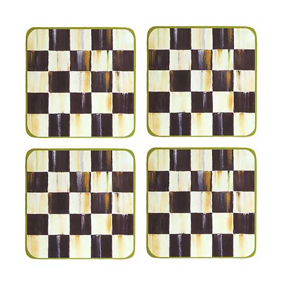 Set of four square coasters with a hand-painted black and white checkered pattern and green borders.