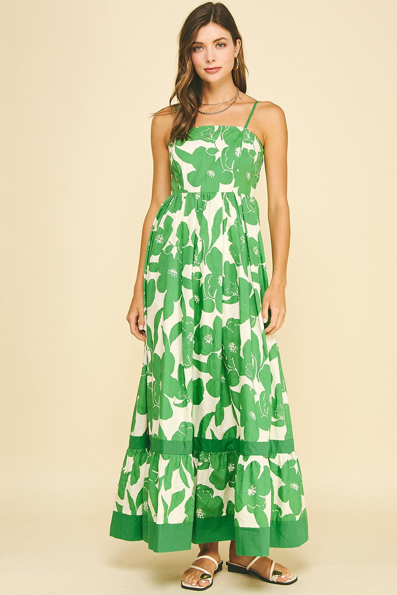 Maxine floral tiered maxi dress in white cotton with a flowing A-line silhouette and ruffled neckline.
