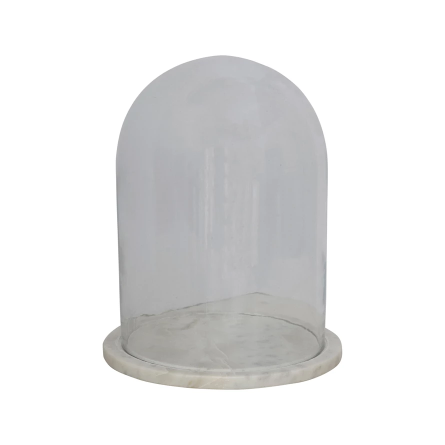 Set of two glass cloches with marble bases featuring a clear dome shape over white and gray stone.