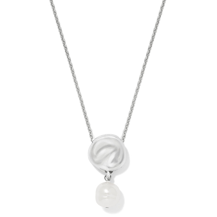 Cascade Round Pearl Necklace with a silver textured disc and a white baroque glass pearl drop.