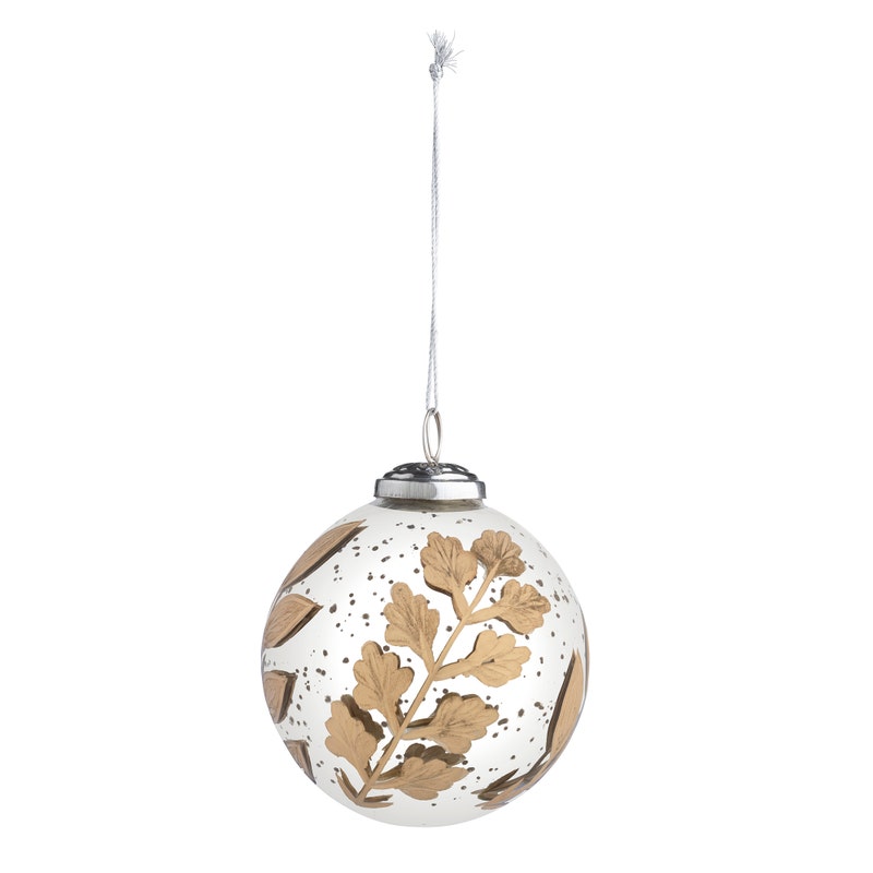 Round antique mercury glass ornament with gold etched botanical leaf patterns and a silver cap.