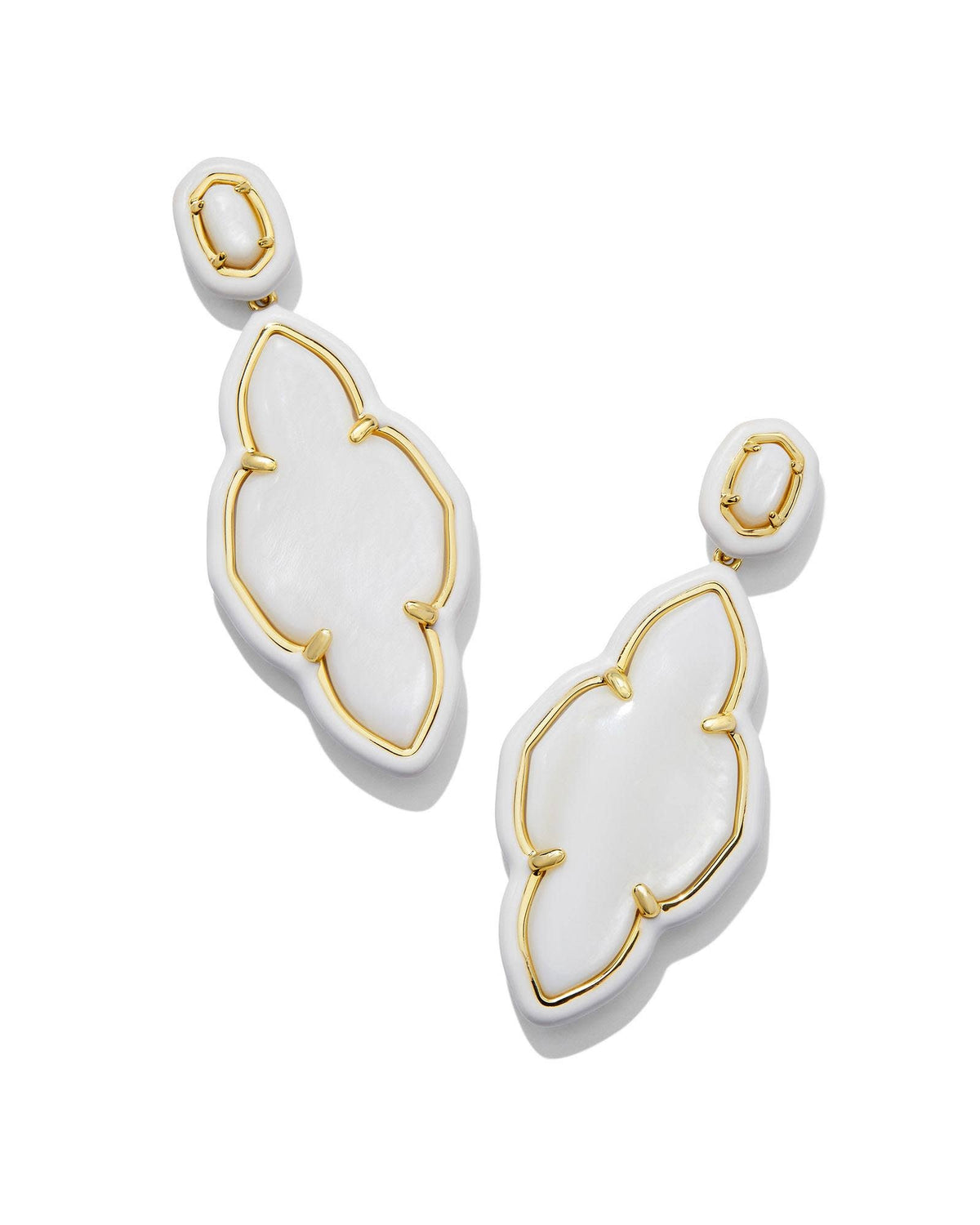 Gold enamel frame statement earrings with a white stone center on an ear post closure.