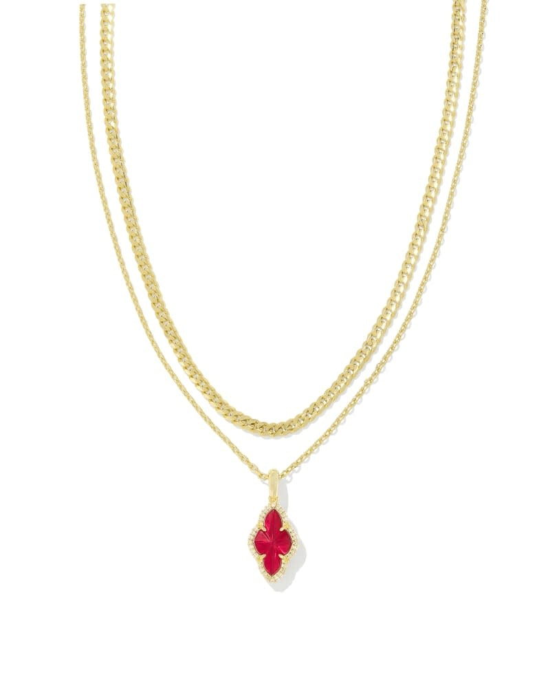 Gold multi-strand necklace with adjustable length featuring sparkling pave frame pendants.