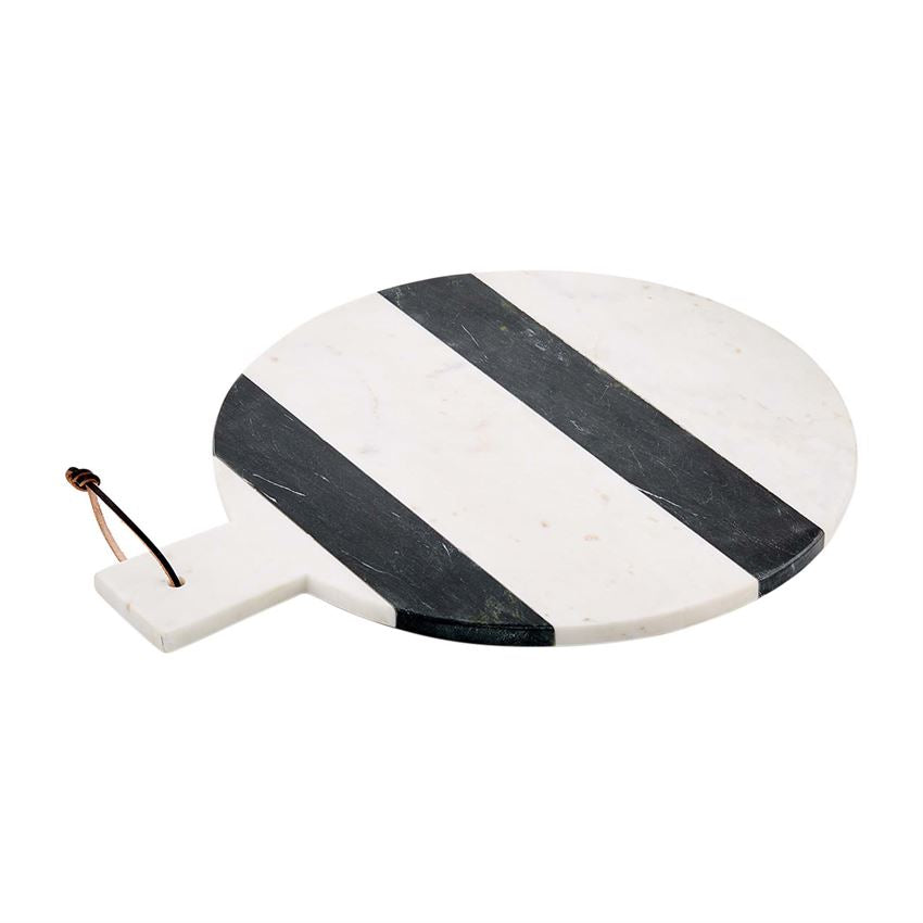 Round marble serving board with a striped geometric pattern in neutral tones.