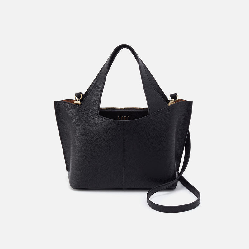 Black pebbled leather Vida Small Tote with top handles and a removable crossbody strap.