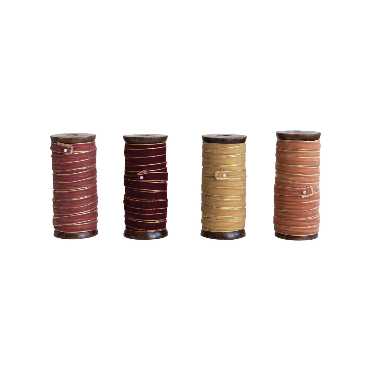 Four wooden spools of velvet ribbon in red, burgundy, gold, and peach with metallic edges.