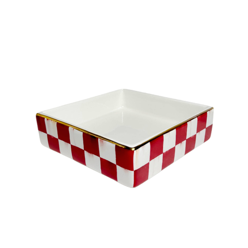 Square ceramic cocktail napkin holder with a red and white checkered pattern and gold rim.