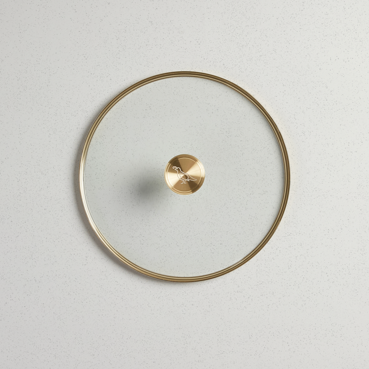 12-inch tempered glass lid with a gold-toned rim and a matching gold knob featuring a bird logo.