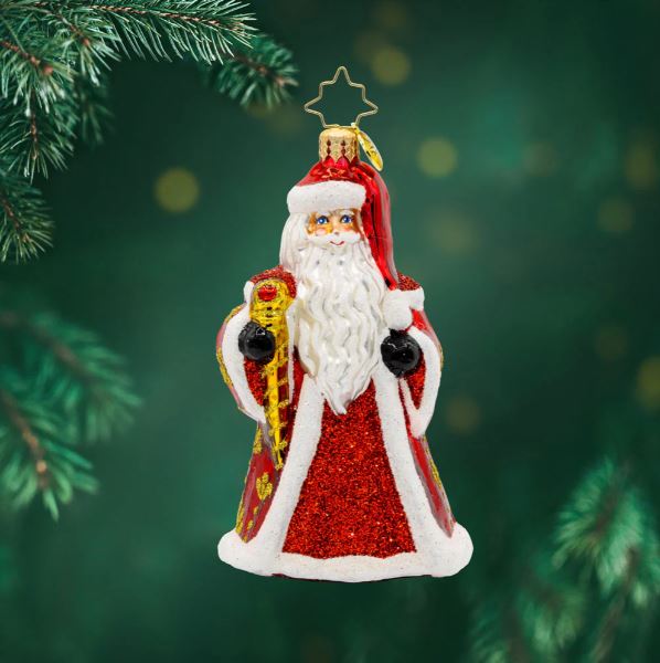 Glass Santa ornament with red glitter coat, white trim, and gold staff.