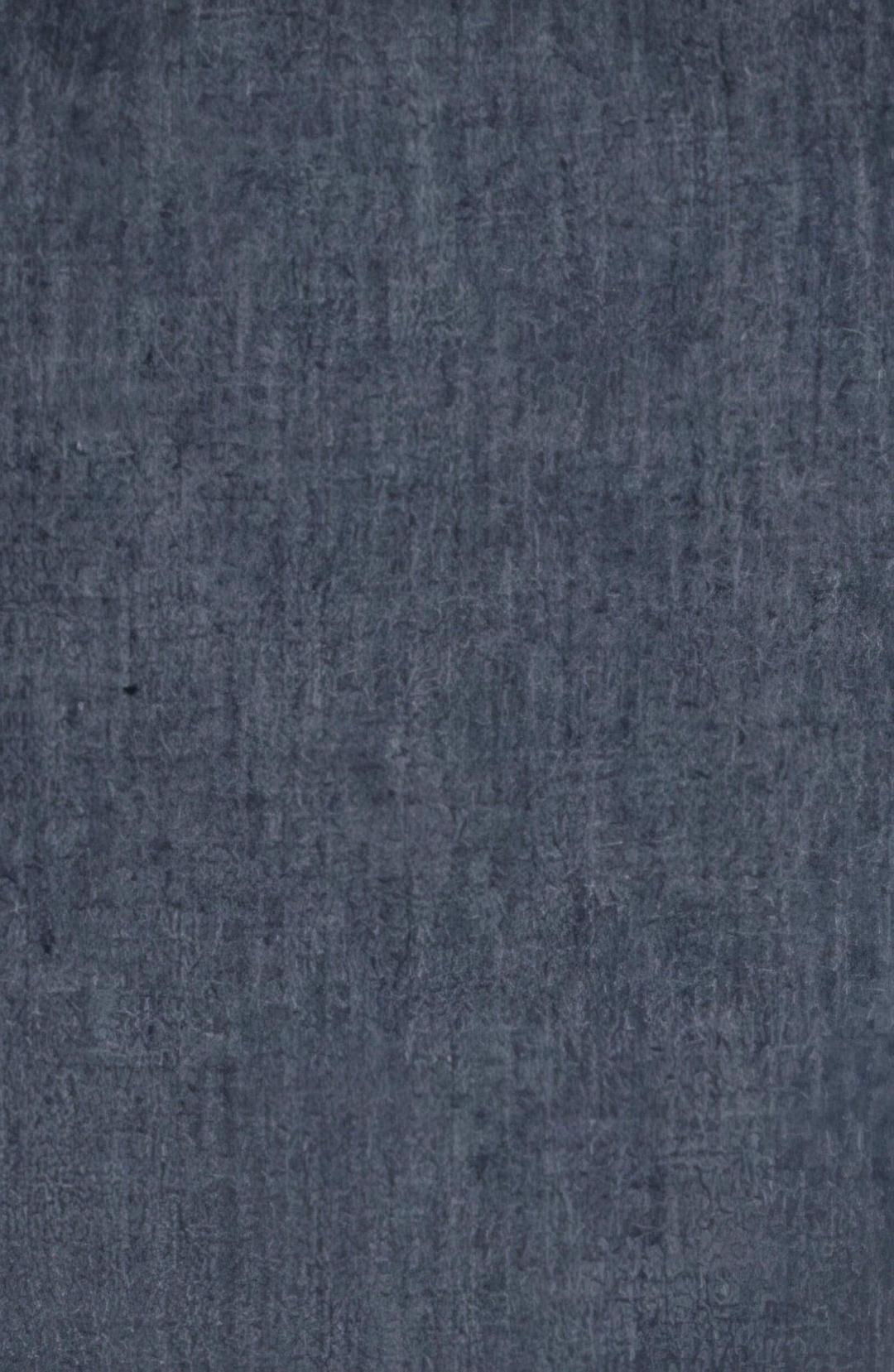 Close-up of dark blue textured cotton fabric with a subtle woven pattern.