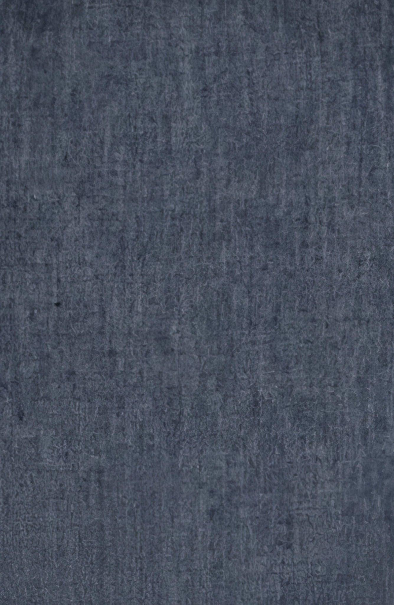 Close-up of dark blue textured cotton fabric with a subtle woven pattern.