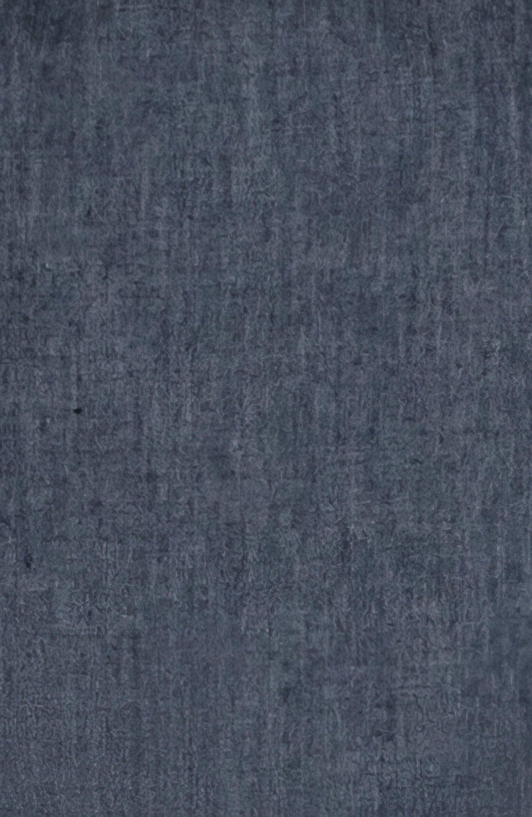 Close-up of dark blue textured cotton fabric with a subtle woven pattern.