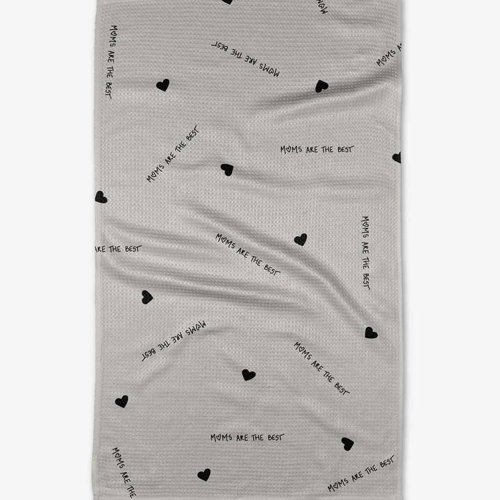 Mother's Day tea towel with waffle weave, featuring 'Moms are the best' text and heart patterns.