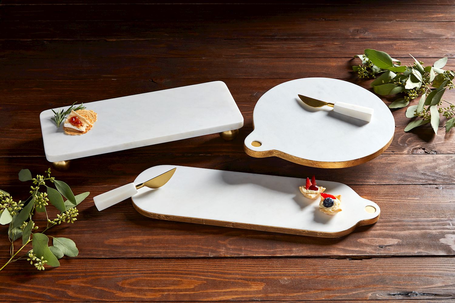 Gold-footed rectangular marble board measuring six by fifteen inches