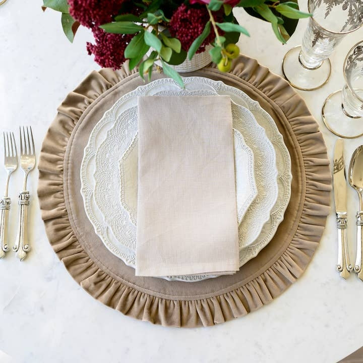 Round ruffle velvet placemat in a soft neutral tone with an 18-inch diameter.