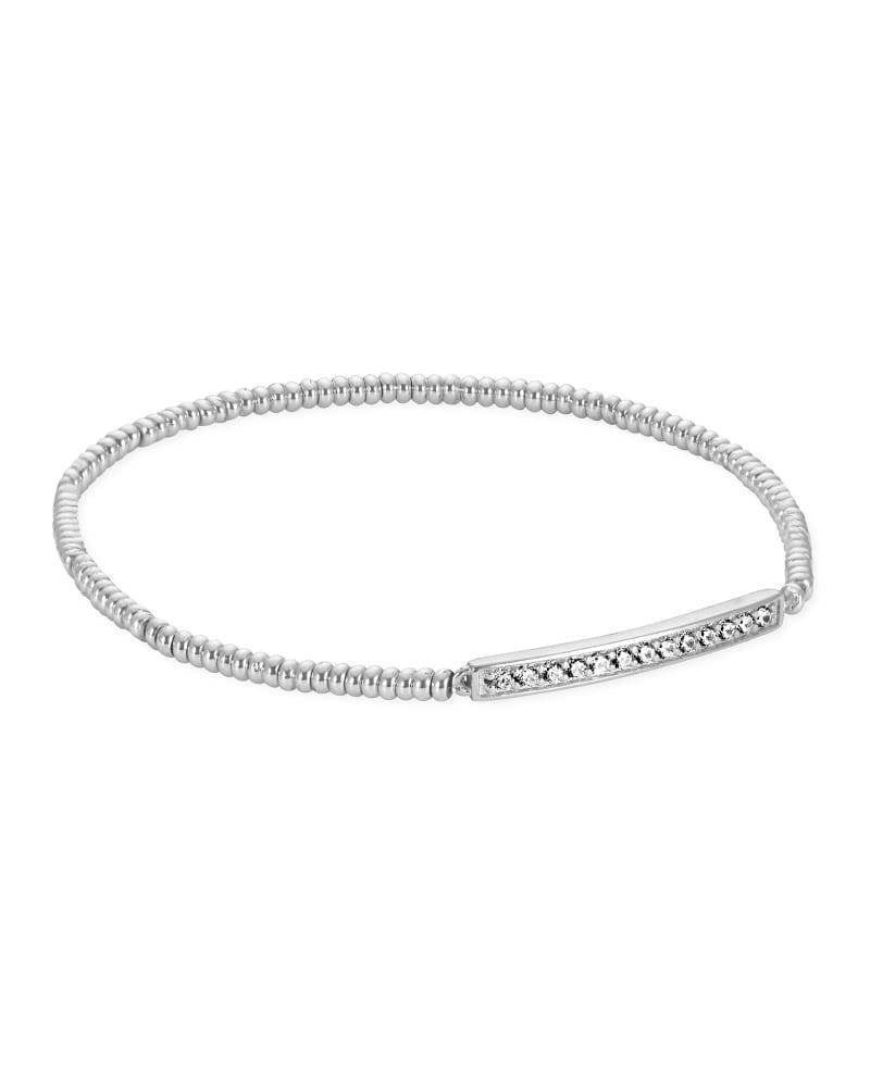 Silver stretch bracelet with subtle sparkle stations on a plain background.