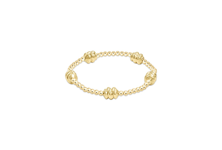 Gold Admire bracelet featuring three-millimeter gold-filled beads on high-performance elastic.